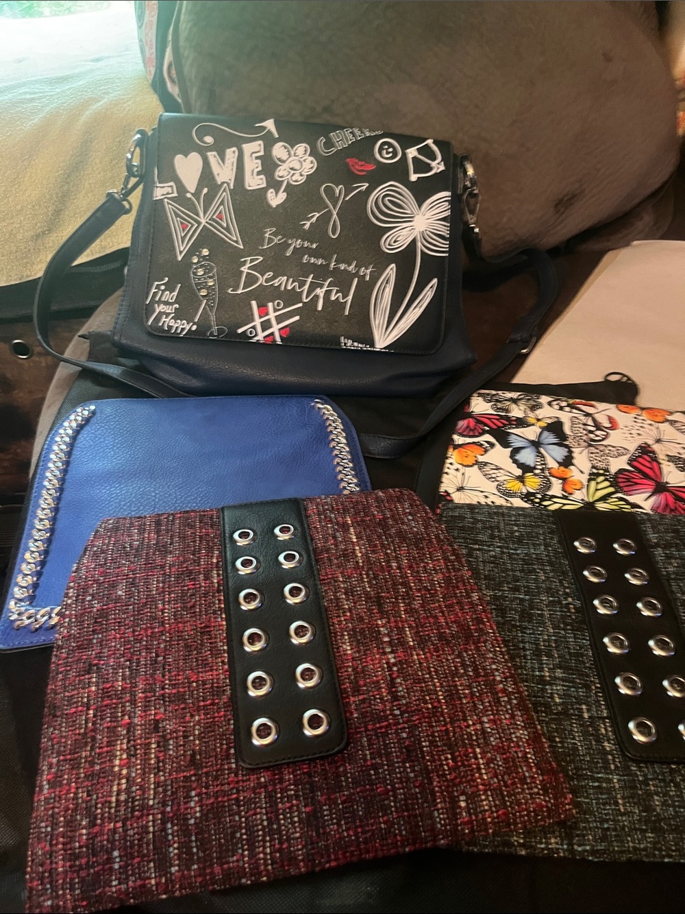 Black interchangeable crossbody bag.